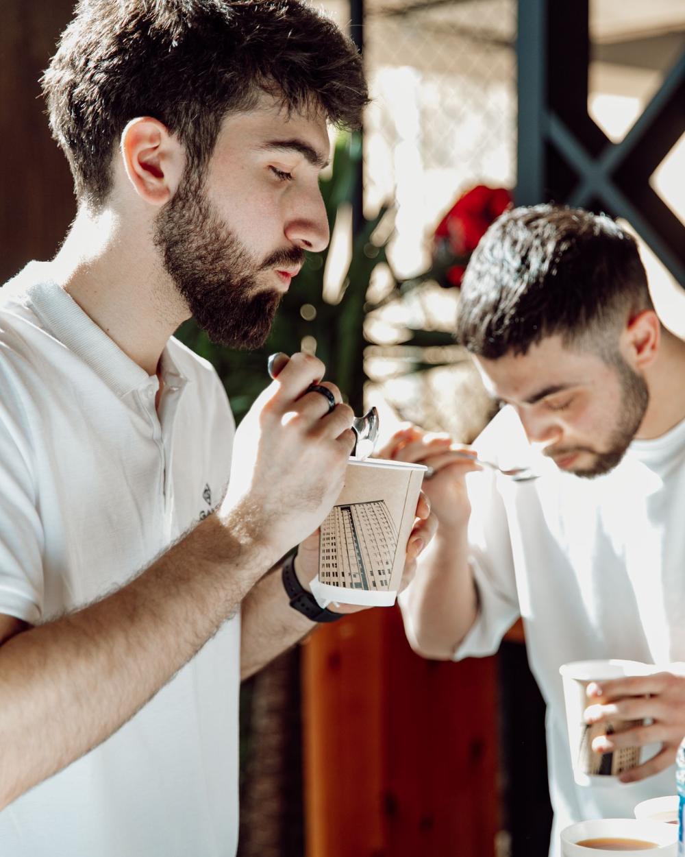 Two evaluators tasting coded samples