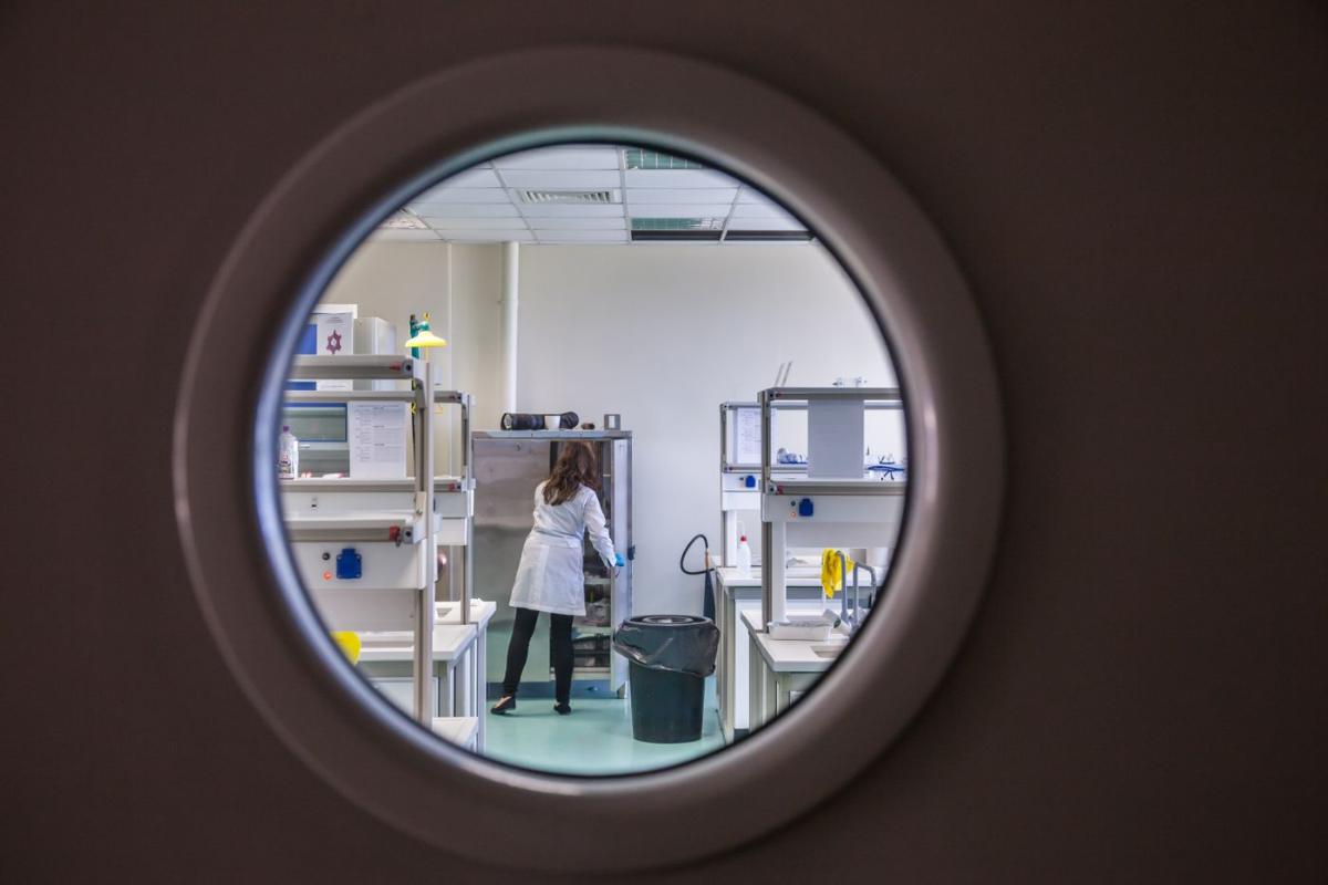 View through a porthole window into a laboratory
